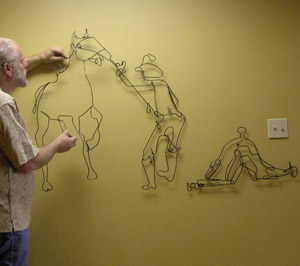 wire mural being installed